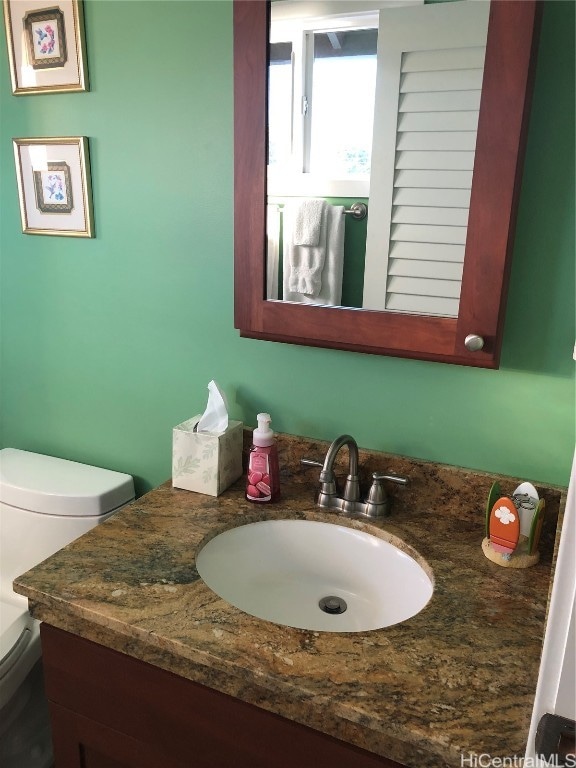 bathroom with vanity and toilet