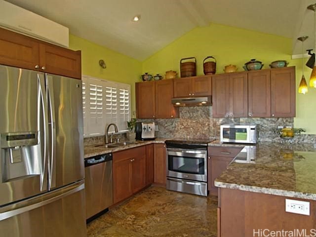 kitchen with kitchen peninsula, sink, lofted ceiling with beams, appliances with stainless steel finishes, and tasteful backsplash