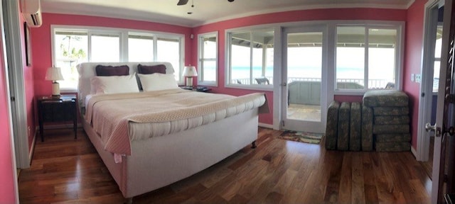 bedroom featuring crown molding, an AC wall unit, dark wood-type flooring, and ceiling fan