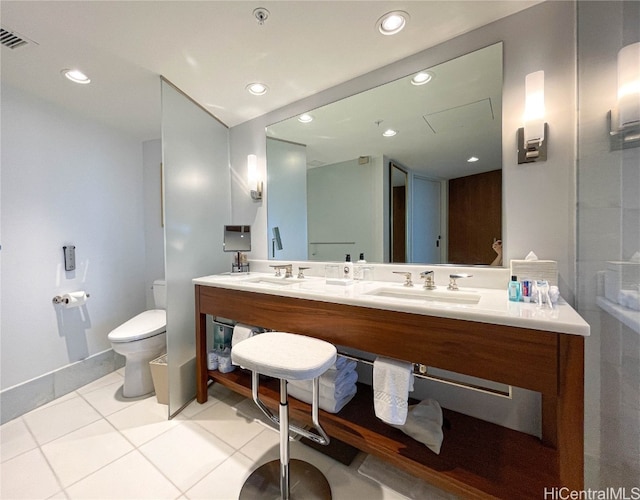 bathroom featuring vanity, toilet, and tile patterned floors