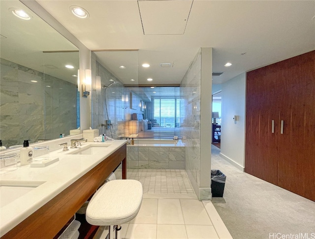 bathroom featuring vanity, tile patterned floors, and shower with separate bathtub