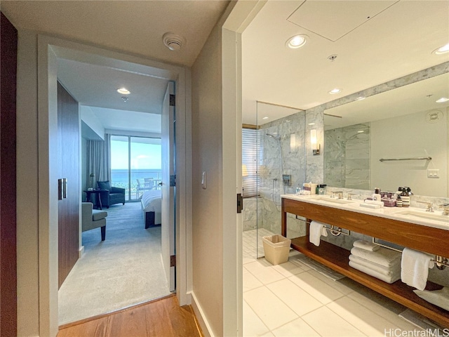 bathroom featuring vanity, hardwood / wood-style floors, and walk in shower