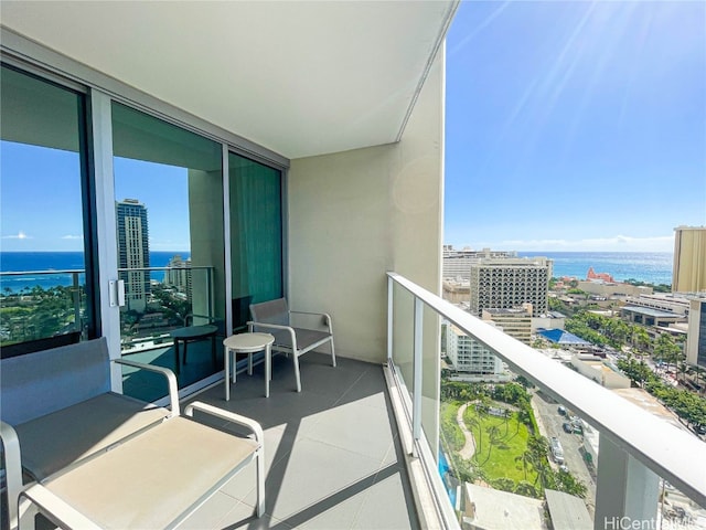 balcony featuring a water view