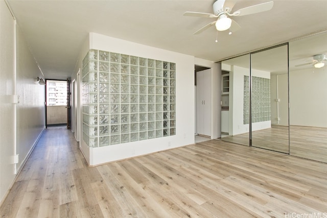 spare room with light hardwood / wood-style flooring and ceiling fan