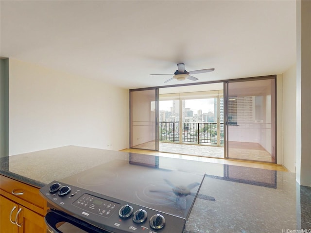 interior space featuring a view of city and ceiling fan