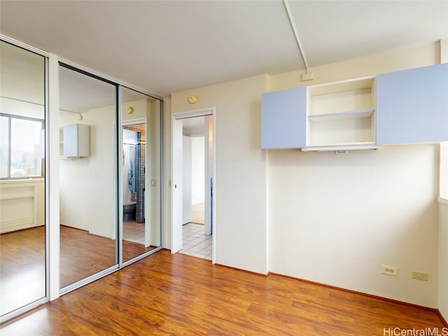 unfurnished bedroom featuring light hardwood / wood-style floors