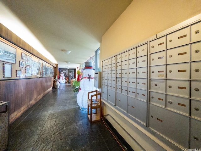 view of home's community featuring mail area