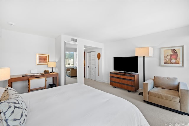 carpeted bedroom with a closet