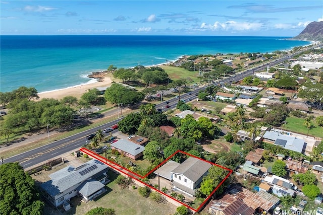 bird's eye view featuring a water view and a view of the beach