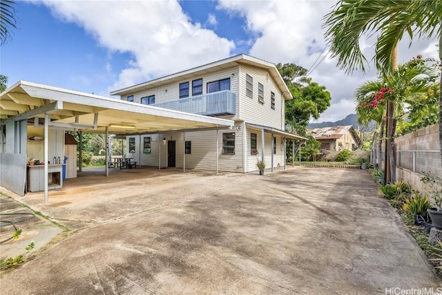 exterior space with a carport