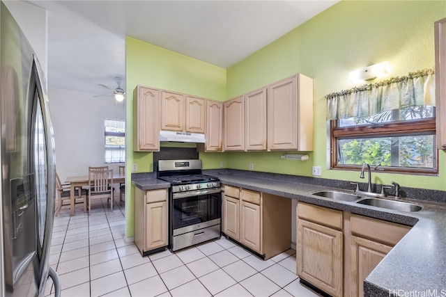 kitchen with ceiling fan, sink, light brown cabinets, stainless steel appliances, and light tile patterned floors