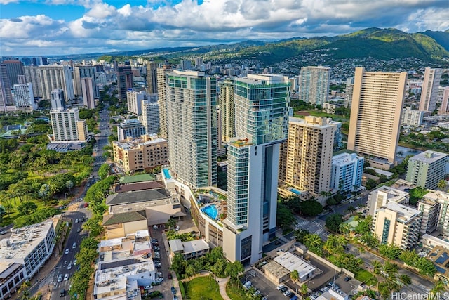 property's view of city with a mountain view