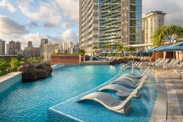 view of swimming pool featuring pool water feature