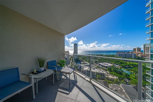 balcony featuring a water view