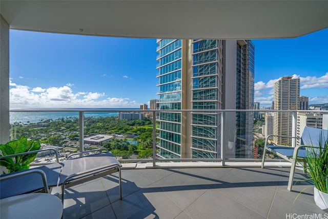 balcony featuring a water view