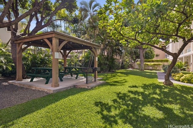 view of property's community featuring a yard and a gazebo