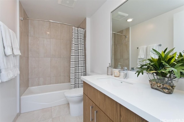 full bathroom featuring tile patterned floors, vanity, shower / bath combination with curtain, and toilet