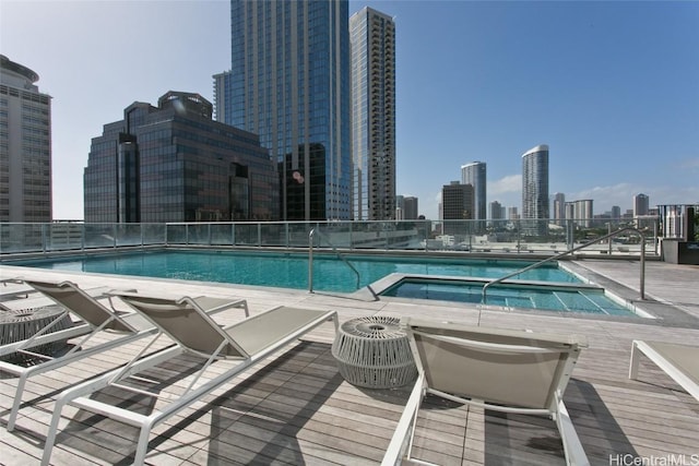 view of pool featuring a hot tub