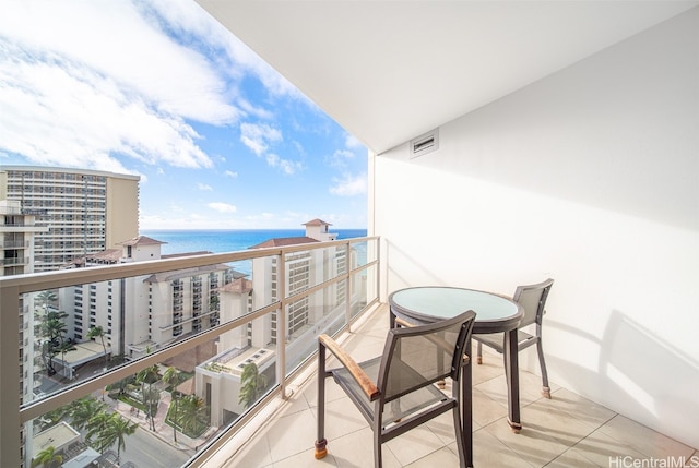 balcony featuring a water view