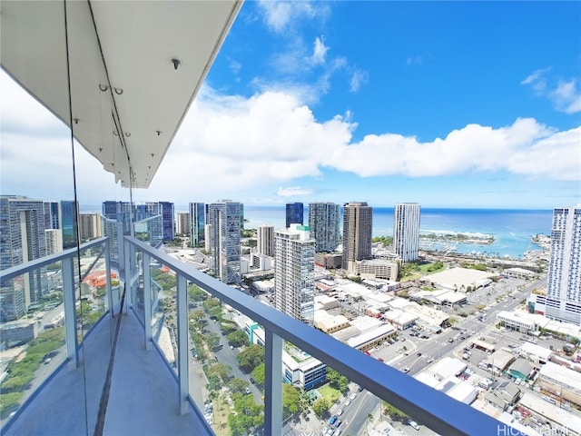 balcony featuring a water view