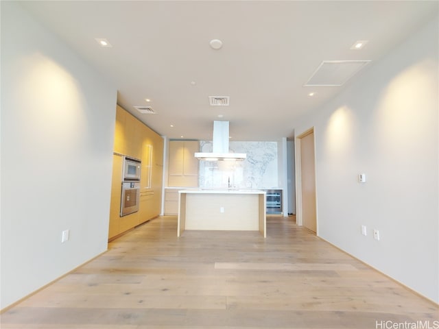 unfurnished living room with light hardwood / wood-style floors