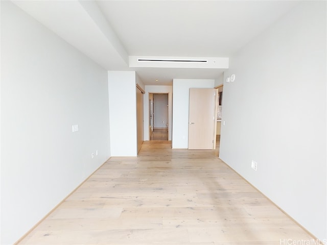 empty room with light wood-type flooring