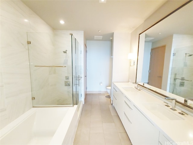 full bathroom featuring vanity, toilet, tile patterned floors, and shower with separate bathtub