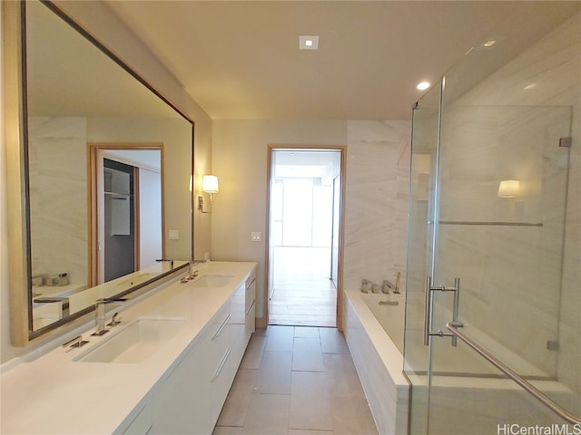 bathroom with vanity, plus walk in shower, and tile patterned floors