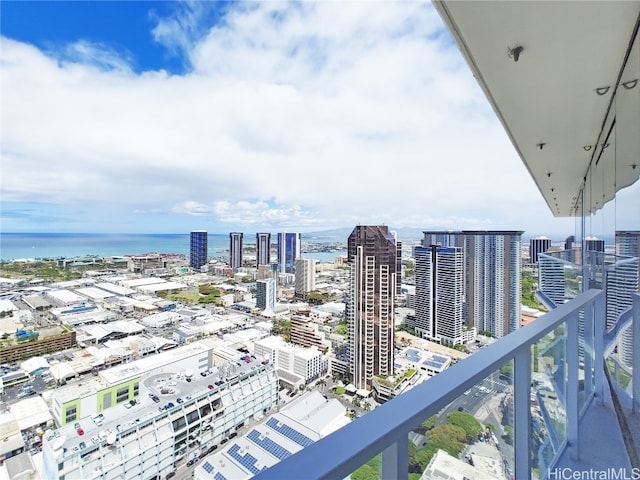 balcony featuring a water view