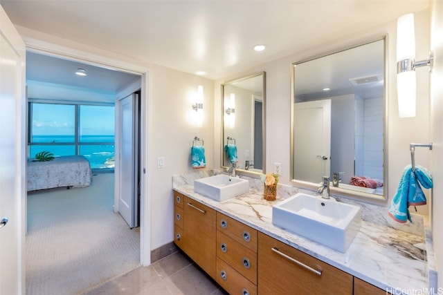 bathroom with vanity and tile patterned flooring