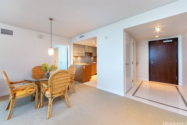 dining space featuring light tile patterned flooring