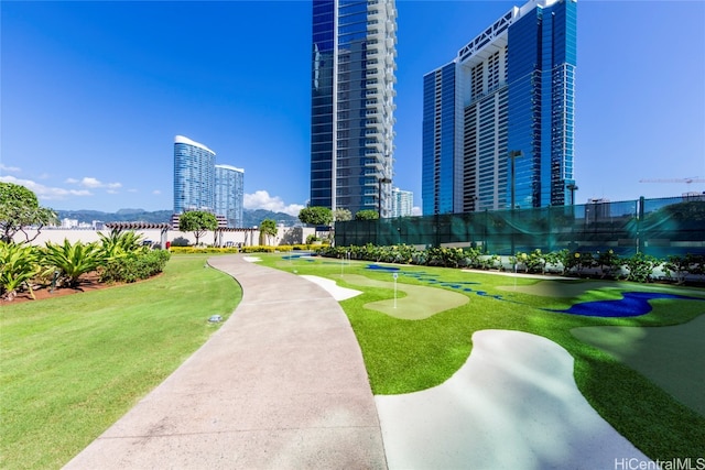 view of home's community featuring a lawn