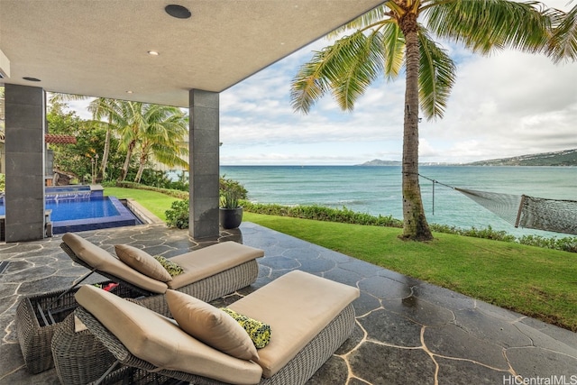 view of patio / terrace with a water view