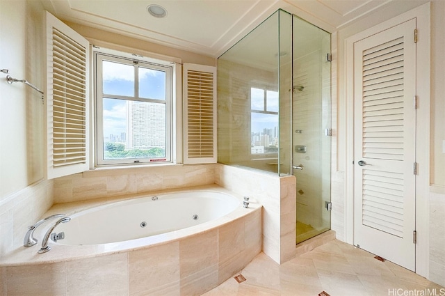 bathroom with separate shower and tub and tile patterned floors