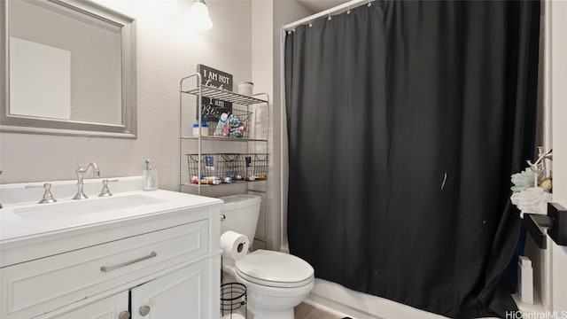 full bathroom featuring vanity, toilet, and shower / tub combo with curtain