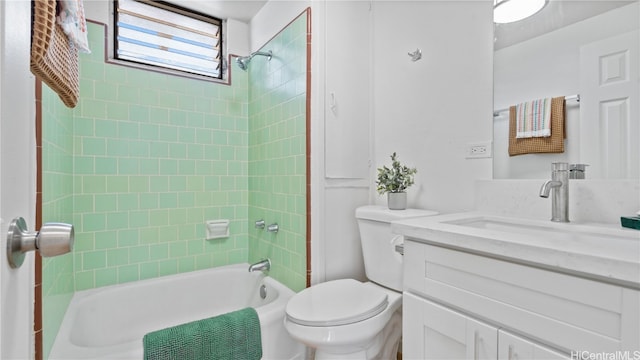 full bathroom with vanity, toilet, and tiled shower / bath combo