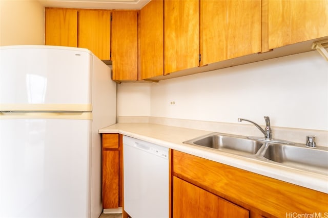 kitchen with sink and white appliances