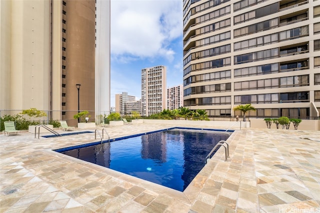 view of swimming pool featuring a patio