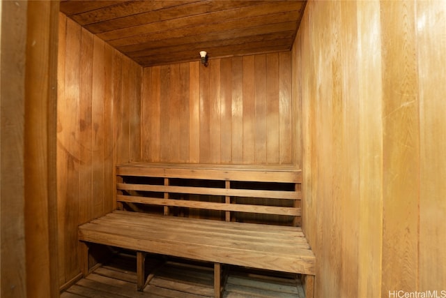 view of sauna with wood ceiling, wood walls, and hardwood / wood-style floors