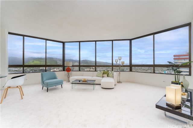 sunroom / solarium with a wealth of natural light and a mountain view