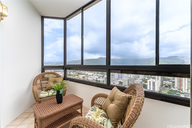 sunroom with a mountain view and a healthy amount of sunlight