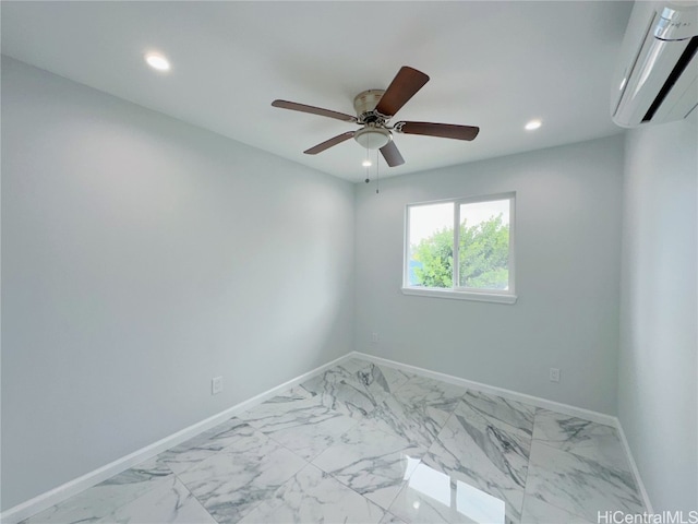 spare room with ceiling fan and a wall unit AC