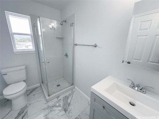 bathroom featuring vanity, an enclosed shower, and toilet