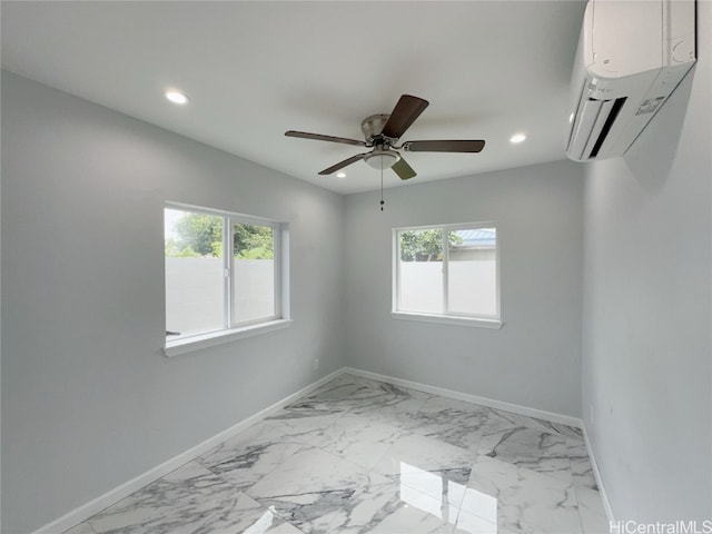 empty room featuring a wall mounted AC, plenty of natural light, and ceiling fan