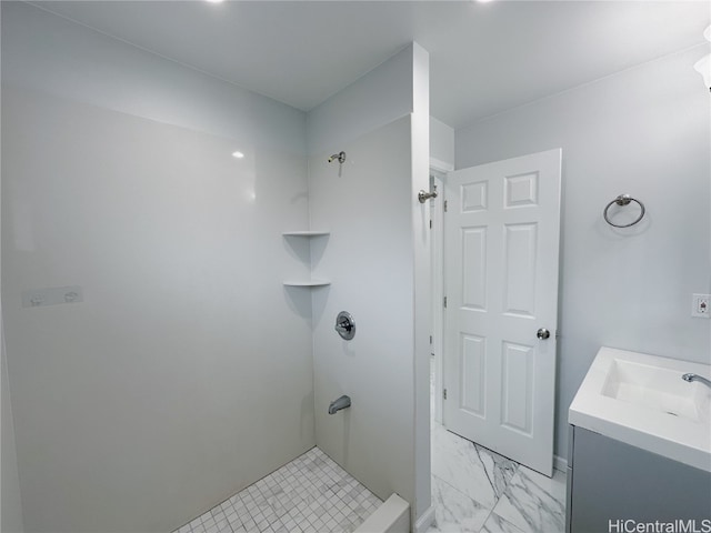 bathroom with vanity and a shower