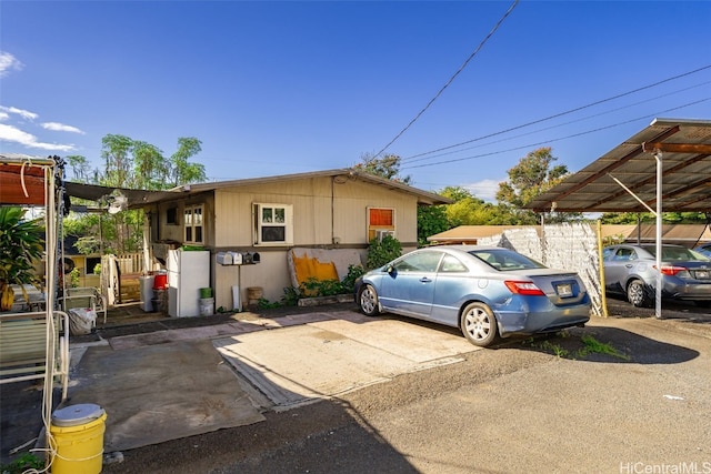 exterior space with a carport