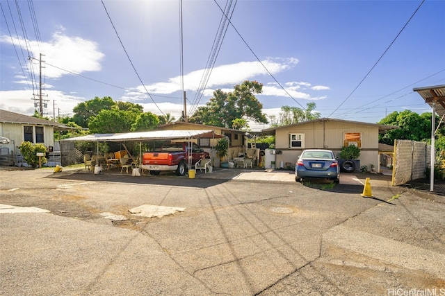 view of vehicle parking with a carport