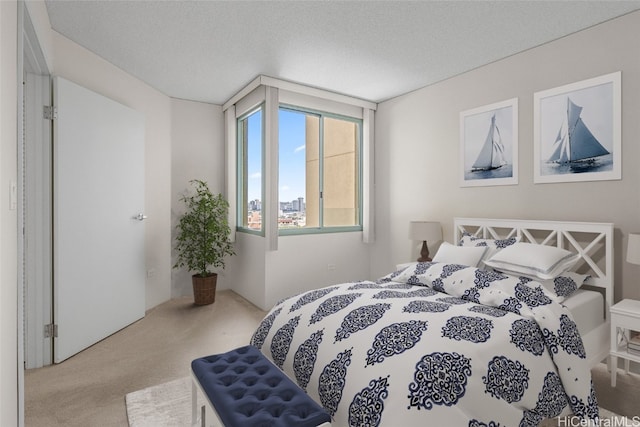 carpeted bedroom with a textured ceiling