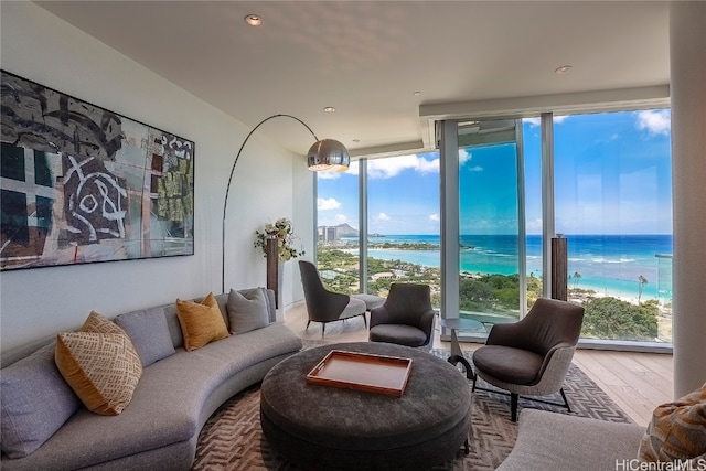 living room featuring a water view and wood-type flooring