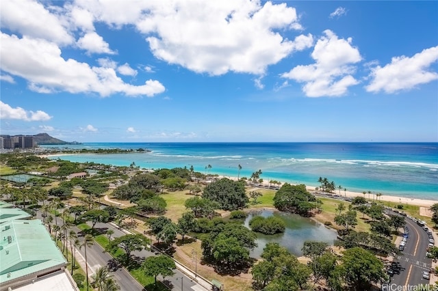 drone / aerial view with a water view and a beach view